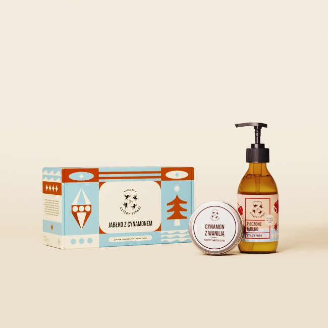 Świąteczny zestaw kosmetyków. Pudełko ze świątecznym nadrukiem, mydło w płynie Jabłko z Cynamonem w szklanej butelce z pompką, mus do ciała Cynamon z Wanilią w aluminiowej puszce. 
